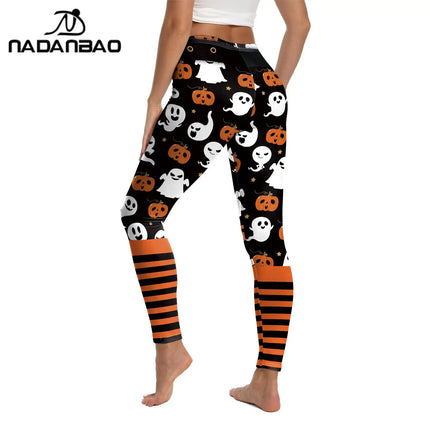 Halloween-themed leggings with ghost, pumpkin, and striped patterns on a white background.

