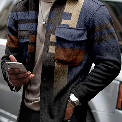 Man wearing a patterned jacket holding a phone, standing next to a car.

