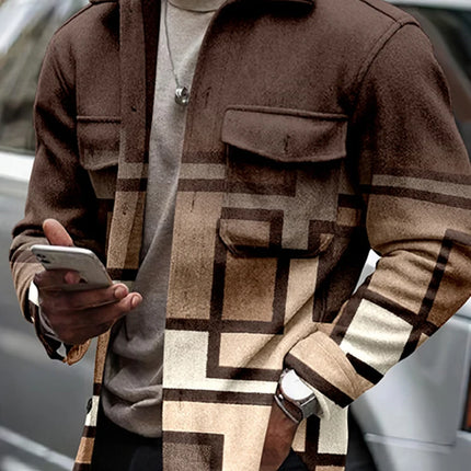 Person wearing a patterned jacket holding a phone outdoors.

