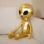gold alien doll